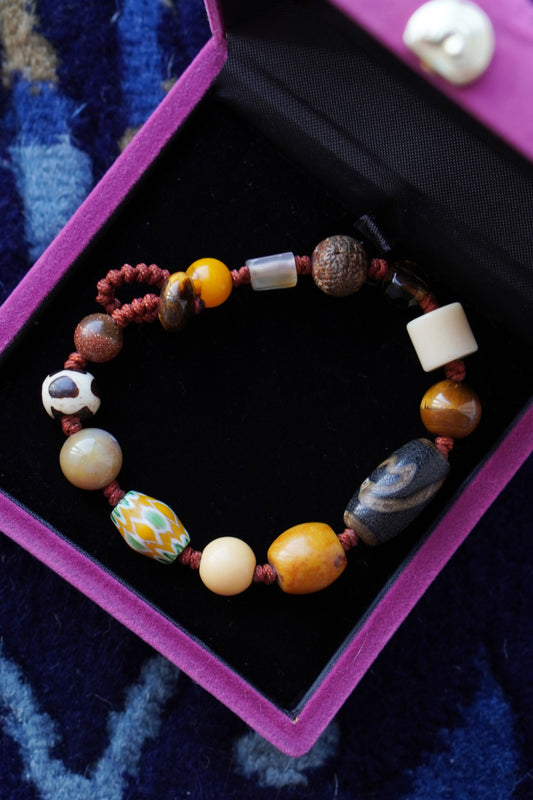 Pulsera tejida de múltiples piedras preciosas tibetanas: ágata roja, coral y ámbar para la buena fortuna